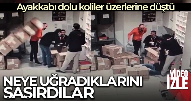 Ayakkabı dolu kolilerin çalışanların üzerine devrildiği anlar kameraya yansıdı