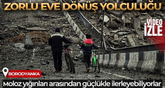 Borodyanka'da babayla kızının yıkılan köprüden eve dönüş yolculuğu